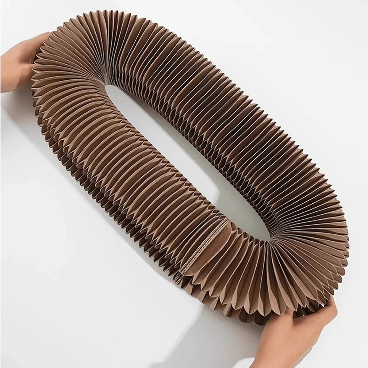 Foldable cat scratcher with interactive elements.