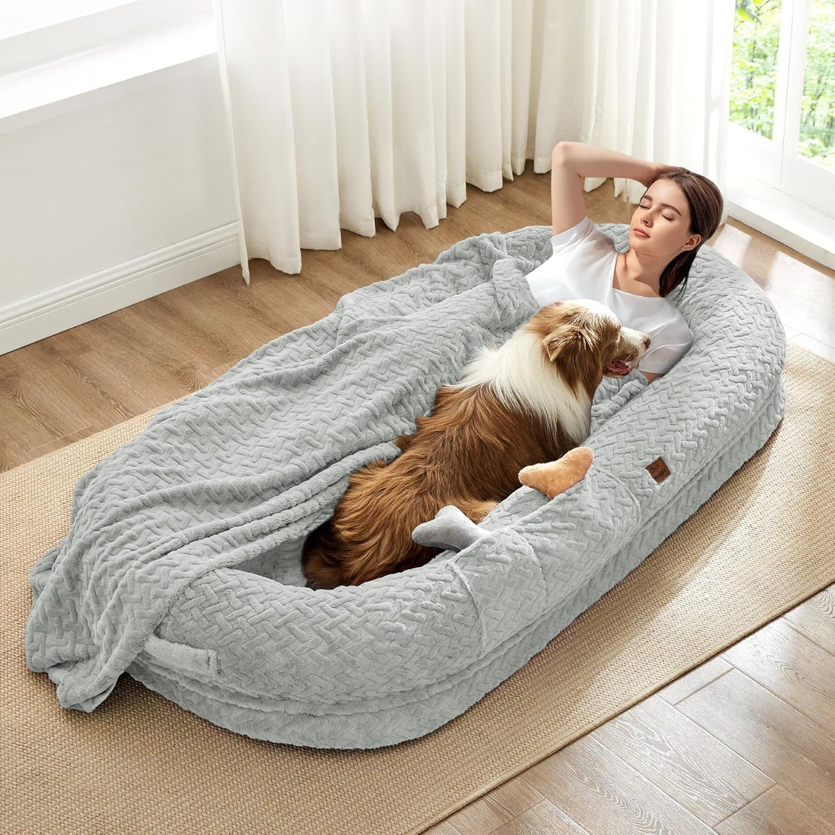 Large comfortable dog bed, plush material with raised edges.